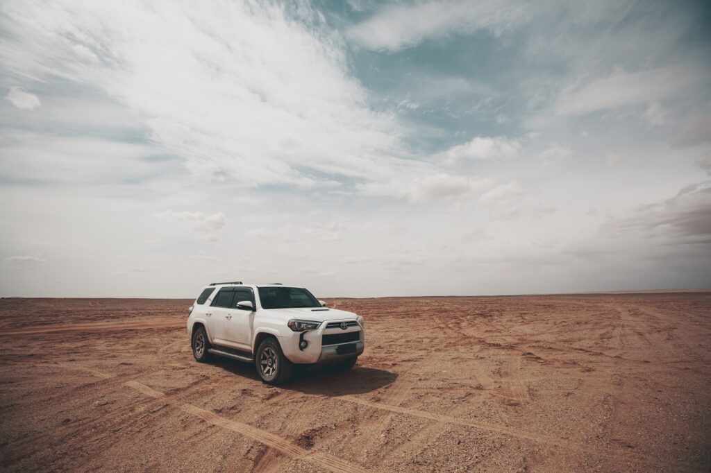 Driving off road car in the desert